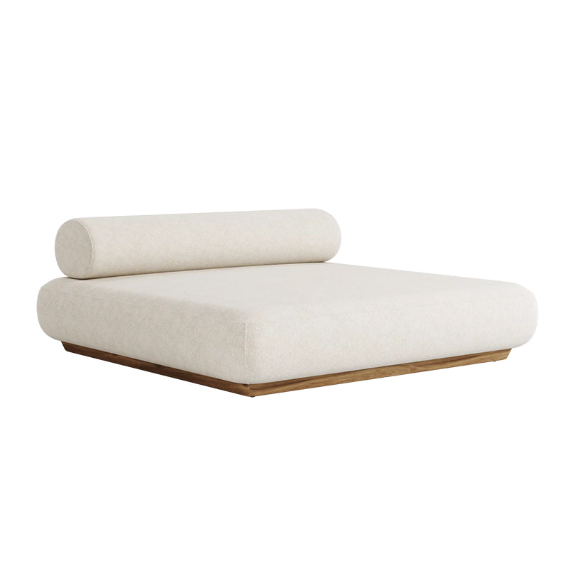 A modern, minimalist daybed or chaise lounge with a plush, cream-colored cushioned seat and back, and a wooden frame in a warm, natural tone. The simple, elegant design creates a cozy and inviting space for relaxation.