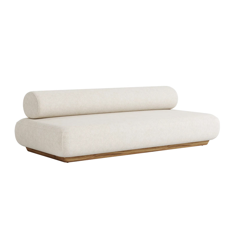 This image depicts a modern, minimalist daybed or chaise lounge with a plush, cream-colored cushioned seat and back, and a wooden frame in a warm, natural tone. The simple, elegant design creates a comfortable and inviting piece of furniture.