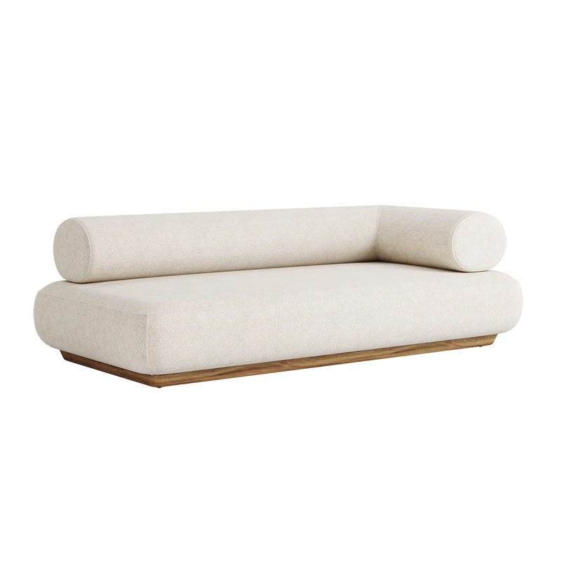 A modern, minimalist daybed or chaise lounge with a plush, cream-colored cushioned seat and back, and a wooden frame in a warm, natural tone. The simple, elegant design creates a comfortable and inviting piece of furniture.